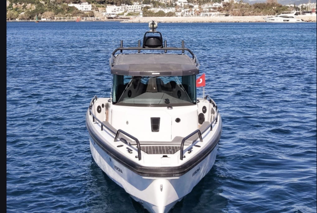 Tesla Travel Axopar 28 Bodrum 7 Passengers luxury private speed boat transfer on the Aegean Sea with VIP Greece island transportation and turquoise crystal-clear waters. Tesla Travel Axopar 28 Bodrum 7 Passengers